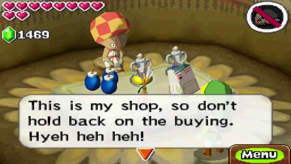 Kogane in his checkered cap behind a table of bombs and potions, saying this is his shop Kogane in his checkered cap behind a table of bombs and potions, saying this is his shop