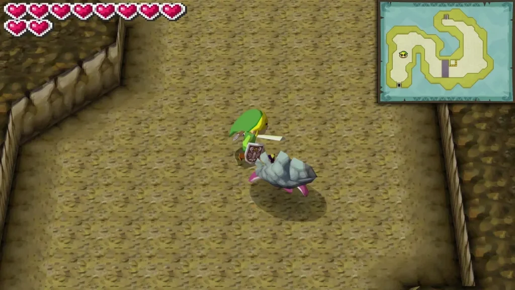 Link swings his sword at a pink Lobarrier hiding behind a grey stone claw on a cave floor in the Ocean Sanctuary Link swings his sword at a pink Lobarrier hiding behind a grey stone claw on a cave floor in the Ocean Sanctuary