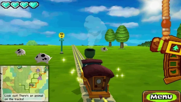 Spotted pigs graze in the grass beside the rails as the Spirit Train rolls toward them Spotted pigs graze in the grass beside the rails as the Spirit Train rolls toward them