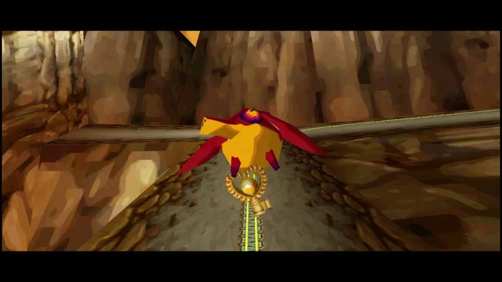 Yellow and red Snurglar carrying a gold key along a Fire Realm canyon track Yellow and red Snurglar carrying a gold key along a Fire Realm canyon track