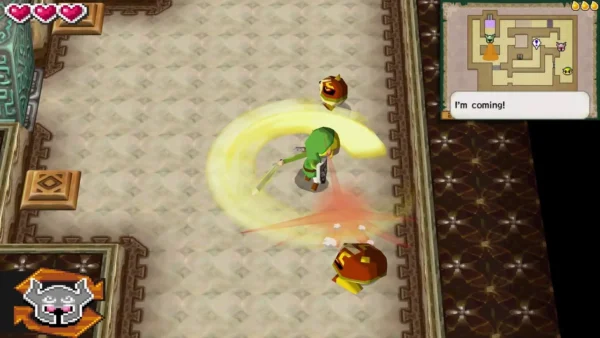 Link's spin attack sweeps between two orange Spinuts in a sandy-floored Tower of Spirits room Link's spin attack sweeps between two orange Spinuts in a sandy-floored Tower of Spirits room