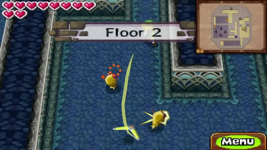 Two yellow ChuChus on a blue Tower of Spirits floor as Link's boomerang path stuns one, with stars circling its head Two yellow ChuChus on a blue Tower of Spirits floor as Link's boomerang path stuns one, with stars circling its head