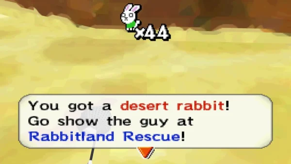 You got a desert rabbit! message on an open sand floor under orange rock You got a desert rabbit! message on an open sand floor under orange rock
