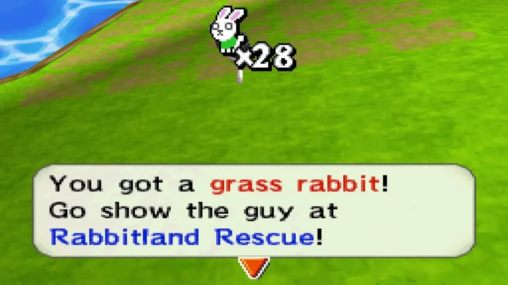 Caught a grass rabbit on a grassy hillside beside water, with the Rabbitland Rescue message box Caught a grass rabbit on a grassy hillside beside water, with the Rabbitland Rescue message box
