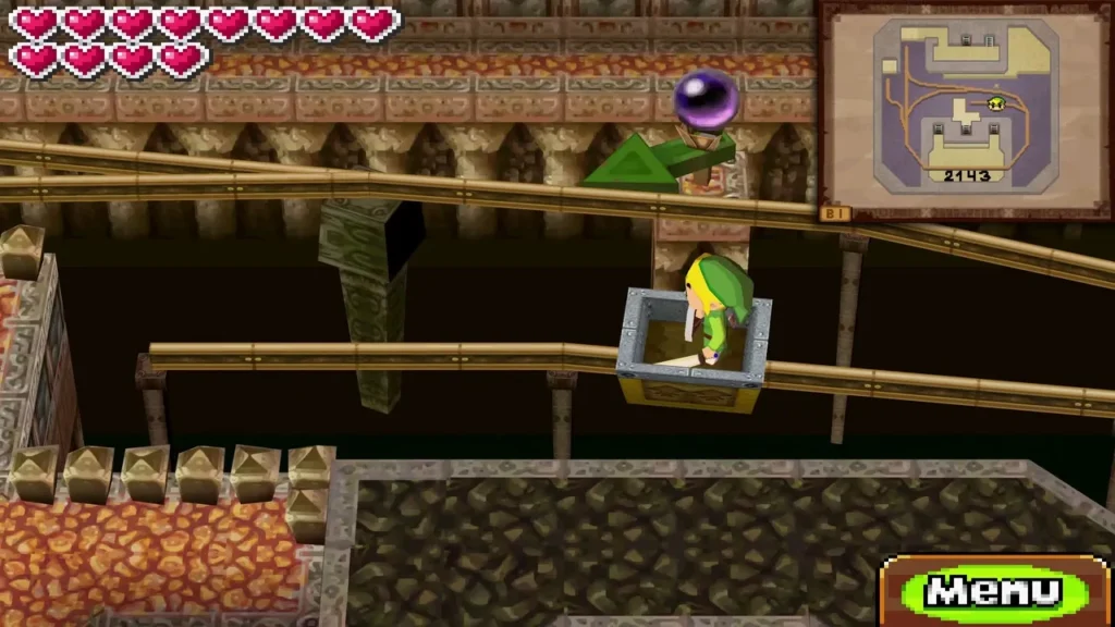 Link riding a mine cart along the rails toward a purple crystal switch in the Fire Temple