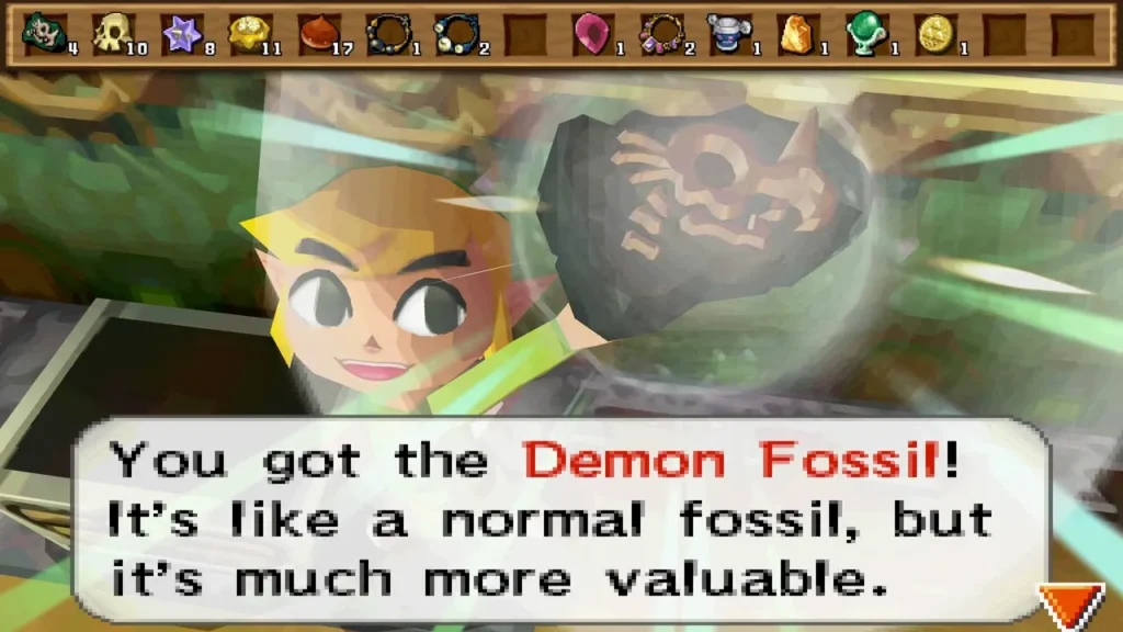 Link holds up a Demon Fossil inside the Tower of Spirits, with the item message box Link holds up a Demon Fossil inside the Tower of Spirits, with the item message box