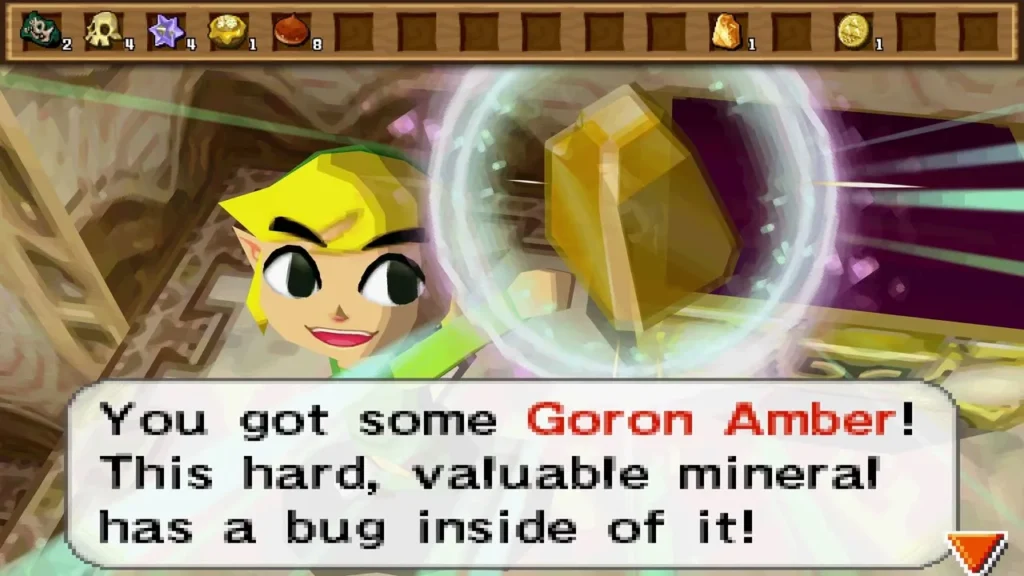 Link holds up a Goron Amber in a Tower of Spirits alcove, with its message box Link holds up a Goron Amber in a Tower of Spirits alcove, with its message box