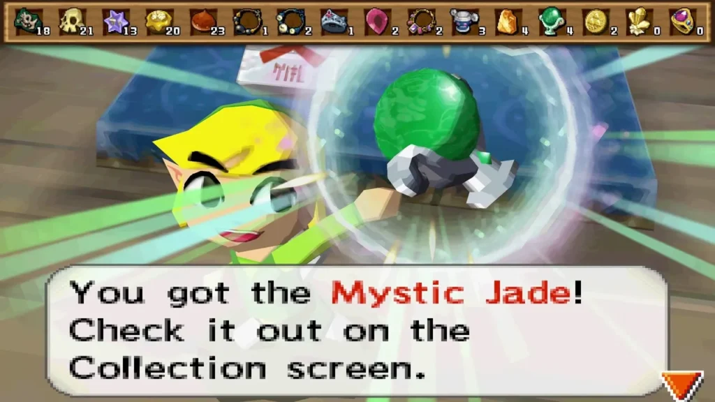 Link holds up a Mystic Jade bought at Beedle's Air Shop, with its item message box fully shown. Link holds up a Mystic Jade bought at Beedle's Air Shop, with its item message box fully shown.