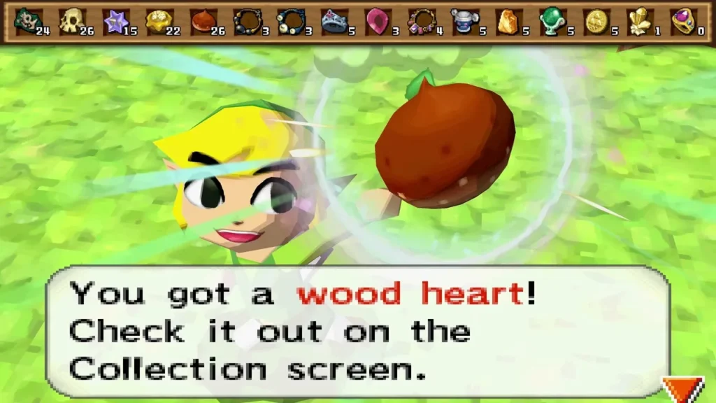 Link holds up a Wood Heart on the Forest Realm grass, with its item message box fully shown. Link holds up a Wood Heart on the Forest Realm grass, with its item message box fully shown.