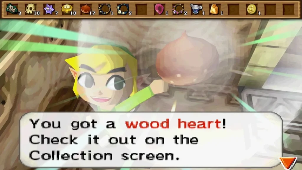 Link holds up a Wood Heart in a Tower of Spirits room on floor 2, with its item message box fully shown. Link holds up a Wood Heart in a Tower of Spirits room on floor 2, with its item message box fully shown.