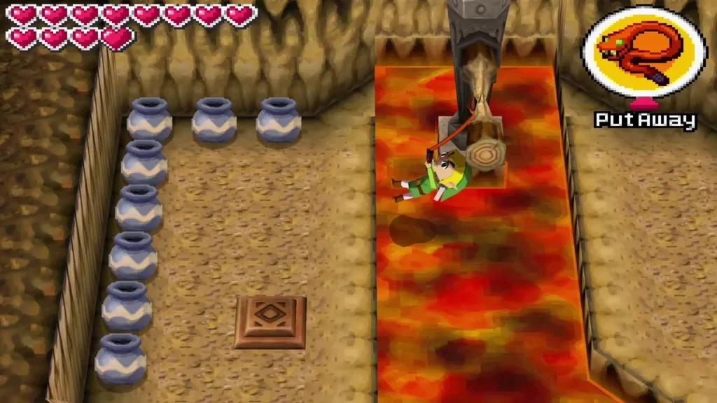 Link whipping across a lava channel toward a wooden pole in the cave beside rows of pots Link whipping across a lava channel toward a wooden pole in the cave beside rows of pots