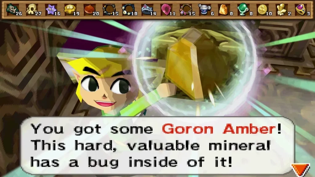 Link holding up Goron Amber, the box reading 'You got some Goron Amber! This hard, valuable mineral has a bug inside of it!'