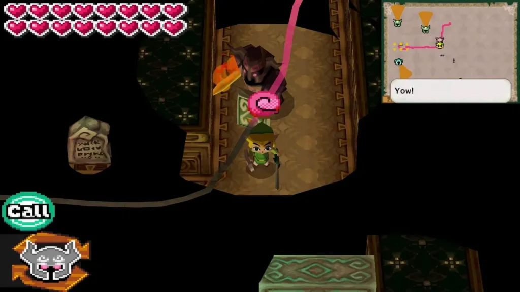 Link fighting a dark Phantom beside a stone tablet, a Yow! box on screen