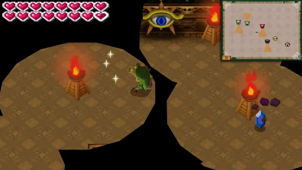 Link in a sand-floored Tower room with torches and a divine eye above