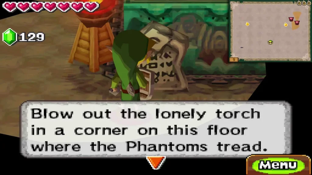 Link beside a tablet with the message to blow out the lonely torch where Phantoms tread Link beside a tablet with the message to blow out the lonely torch where Phantoms tread