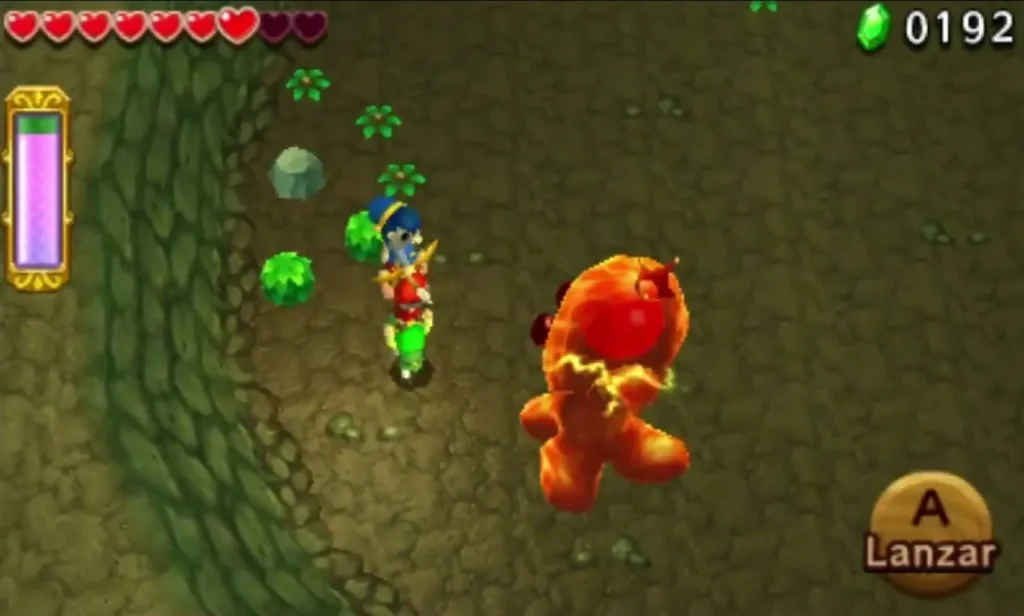 The Electric Blob King turns orange and grows larger as Link fires at it from the cave floor The Electric Blob King turns orange and grows larger as Link fires at it from the cave floor