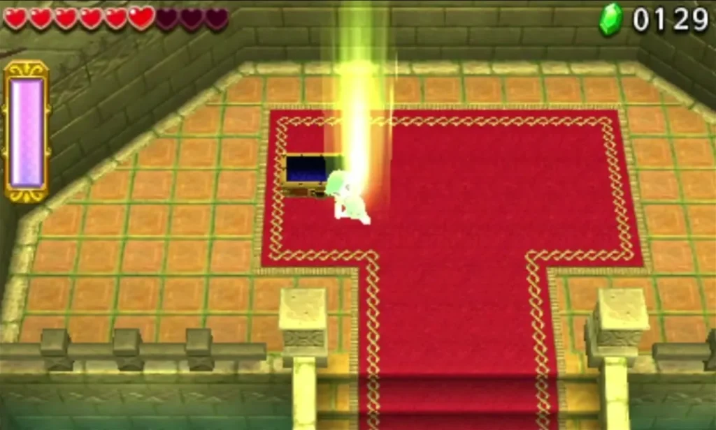 Link standing in a yellow light beam beside a chest in the Deku Forest end room