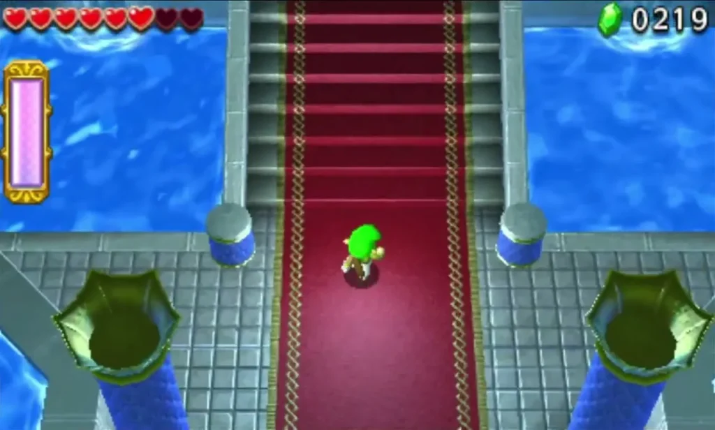Link walking up a red carpet between water channels toward the Secret Fortress end room