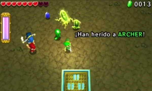 An electrified yellow-green Buzz Blob crackles with lightning beside a plain green Blob in a cave