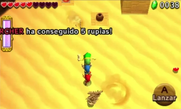A bony Sandfish skims the sand beside a stacked Totem of Links in the Infinity Dunes