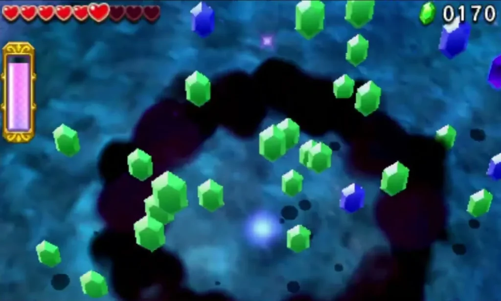 A swirl of green and blue Rupees bursts out of the arena after Blizzagia falls