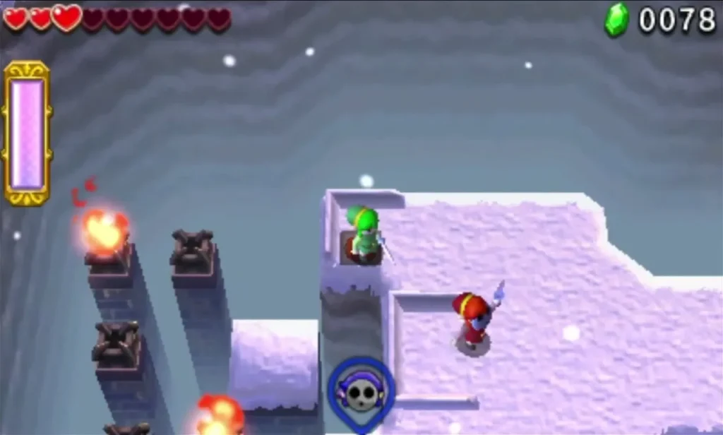 Link on an icy ledge with lit Braziers along the cliff edge in Snowball Ravine stage 2