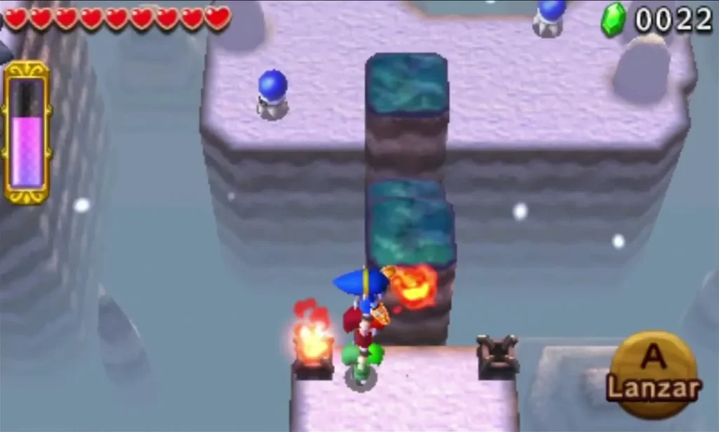 Link lights a Brazier with a fireball on an icy walkway beside a tall ice block