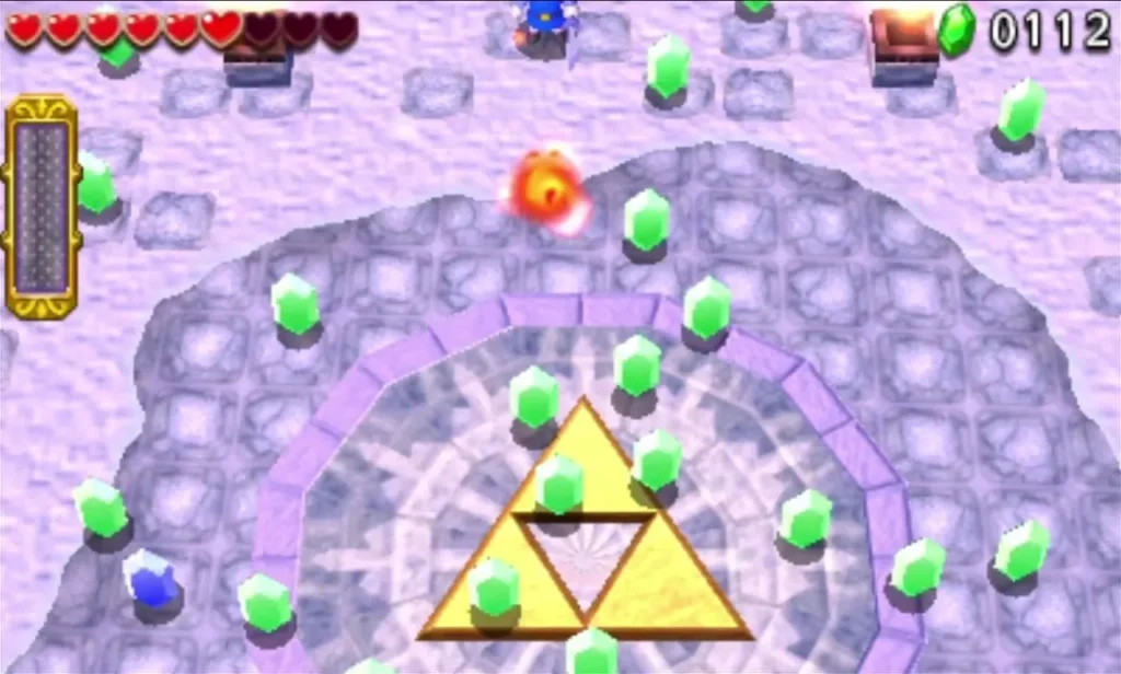 Rupees scattered across the arena around the glowing Triforce Gateway after Freezlord falls