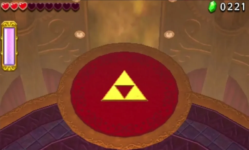 The golden Triforce mark glows on the red floor at the end of the Sky Temple arena