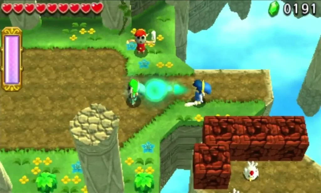 Link stands on a grassy ledge beside cracked red blocks and a white Cucco over the gap