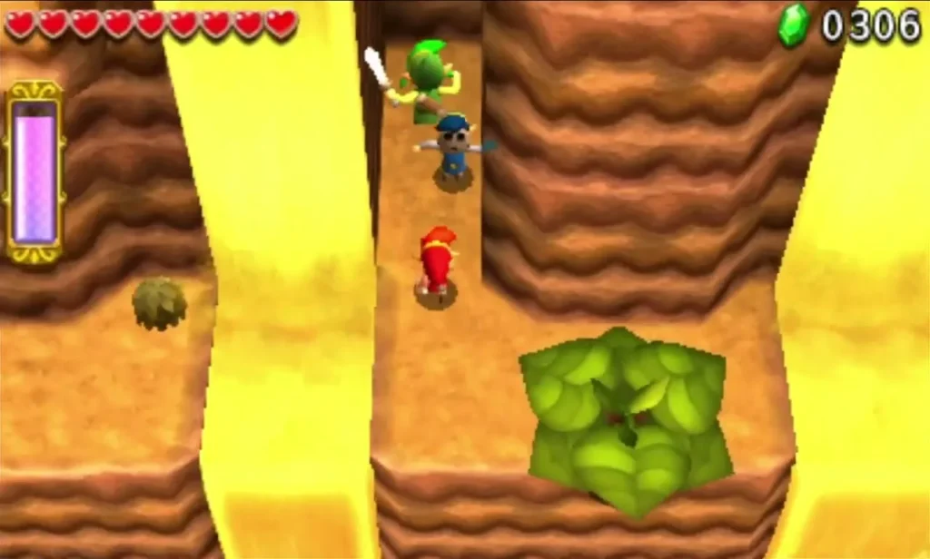 Links on a ledge above a big green plant between sandstone walls and a yellow sand river