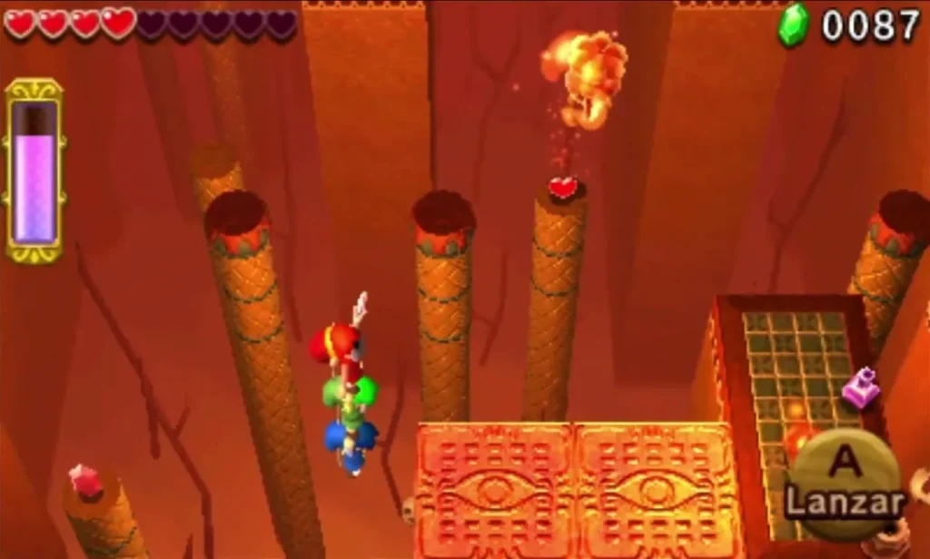 Link on a tiled ledge with a fireball flying over the chasm in Gibdo Mausoleum stage 3