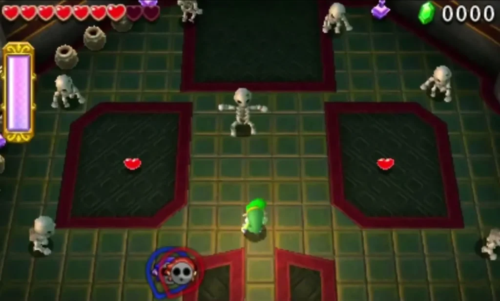 Link in a skull-shaped chamber of the Desert Temple surrounded by Stalfos and hearts on the floor