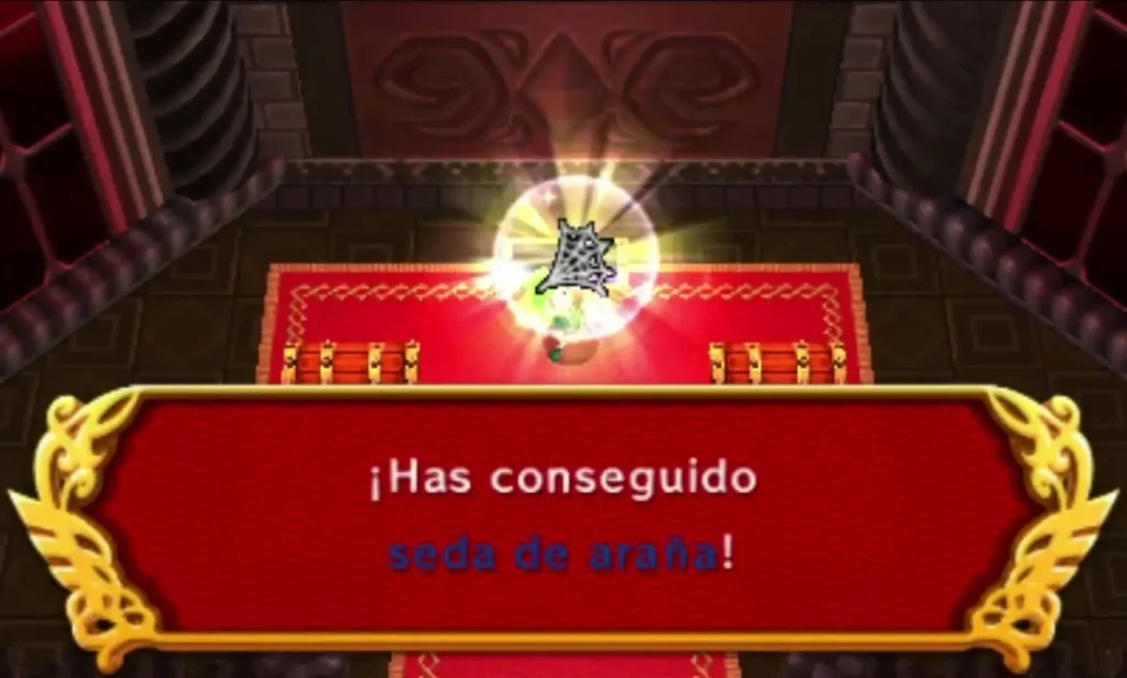 Link holds up a glowing item in the red chest room while the box reads that he got Spider Silk Lace