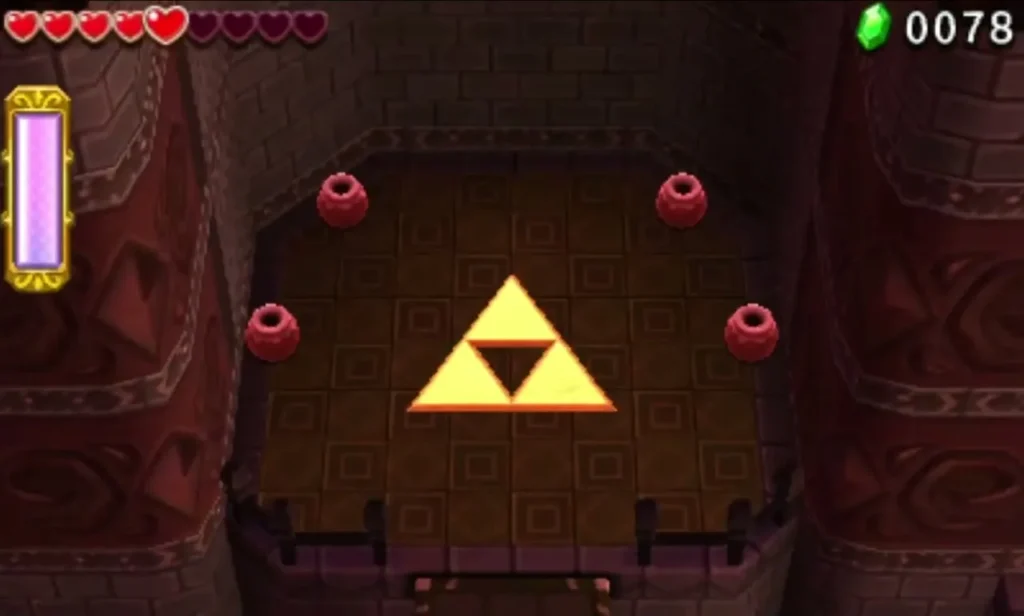 The golden Triforce Gateway glows on a stone floor with red jars around it