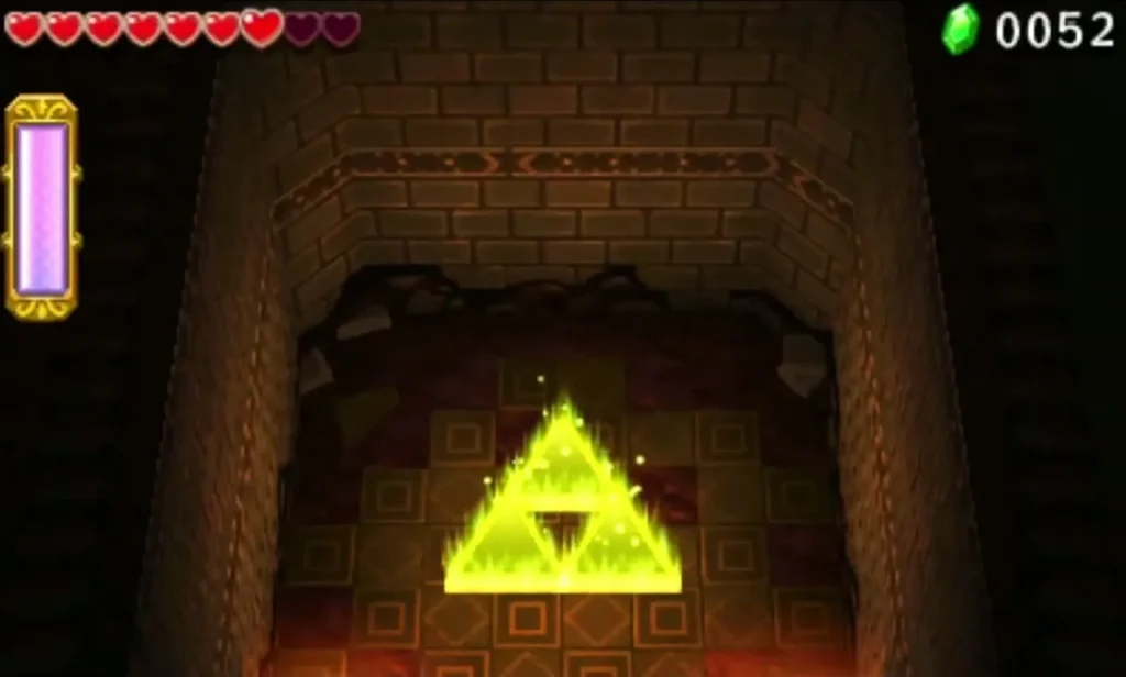 The glowing golden Triforce Gateway stands in a stone alcove at the end of the first stage