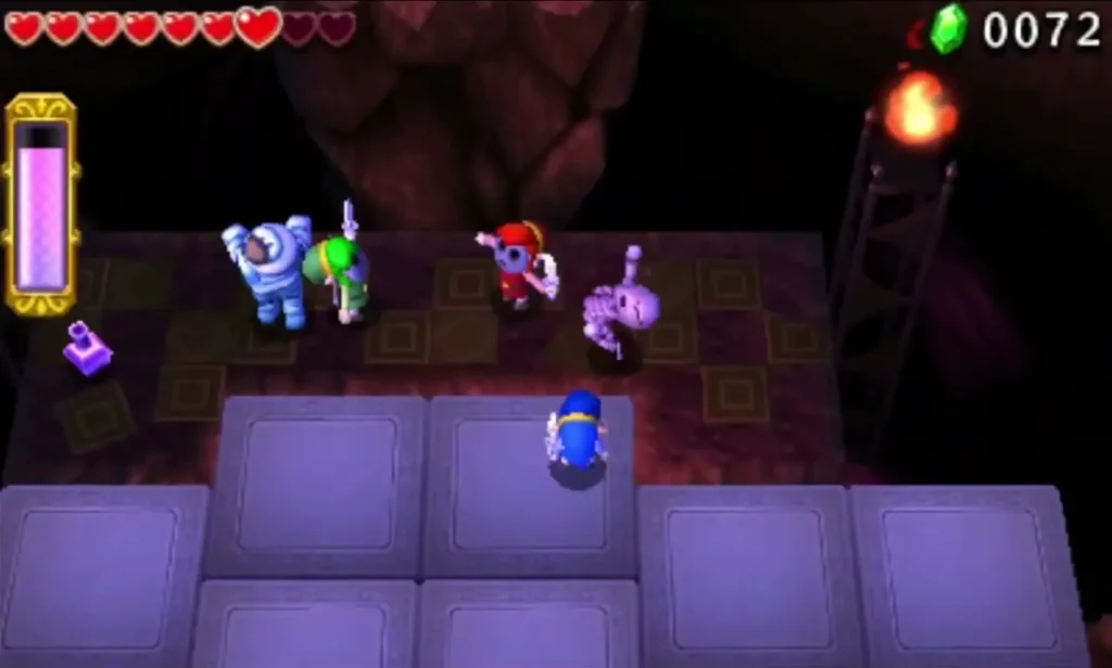 A bandaged Gibdo stands beside two Links on a purple platform with a torch behind