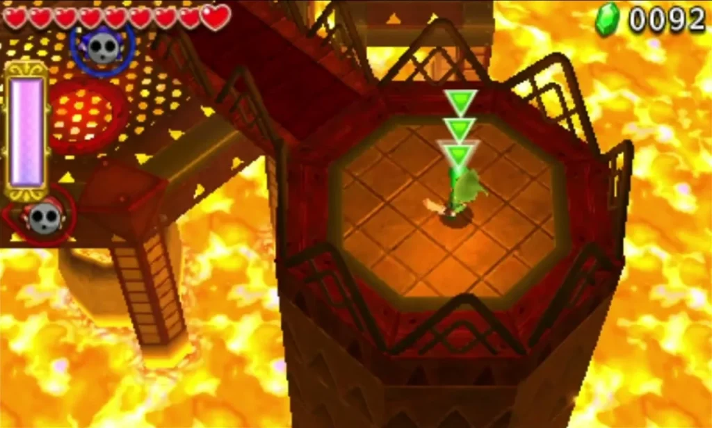 Link stands on a tower catwalk above the lava, with green arrows marking the drop into the arena Link stands on a tower catwalk above the lava, with green arrows marking the drop into the arena