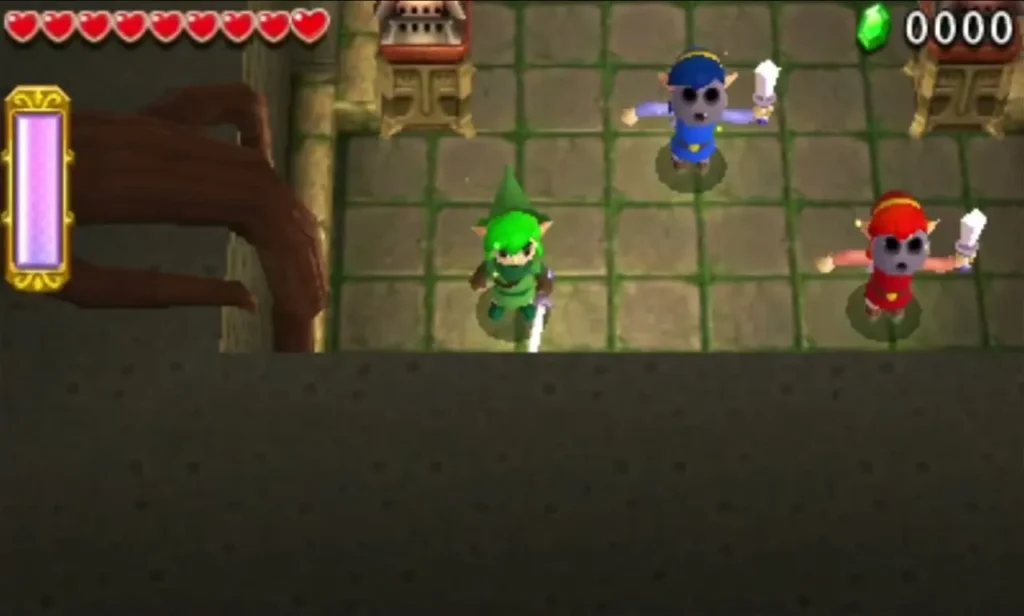 Three Links enter the stone hall of the Forest Temple at the start of the Level