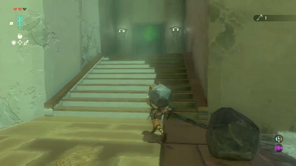 Boulder fused to the end of a long weapon carried across a shrine floor Boulder fused to the end of a long weapon carried across a shrine floor