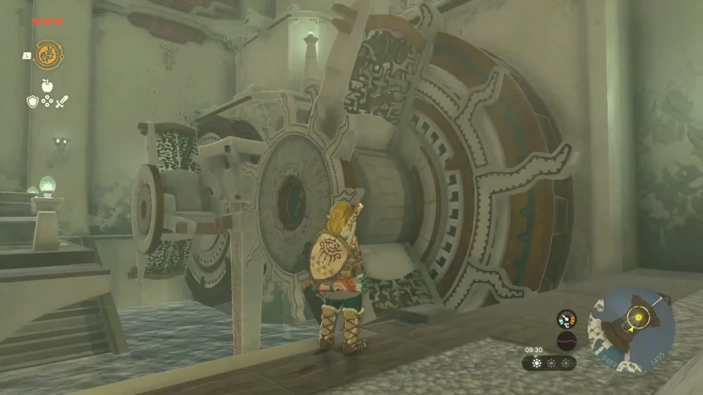 Large stone wheel mechanism beside a water channel in a shrine chamber with a rotating gear Large stone wheel mechanism beside a water channel in a shrine chamber with a rotating gear