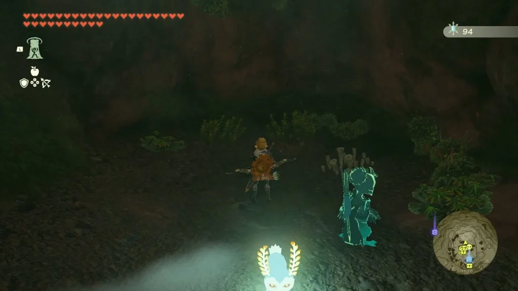 Glowing Bubbul Gem on the cave floor beside a ghostly figure Glowing Bubbul Gem on the cave floor beside a ghostly figure