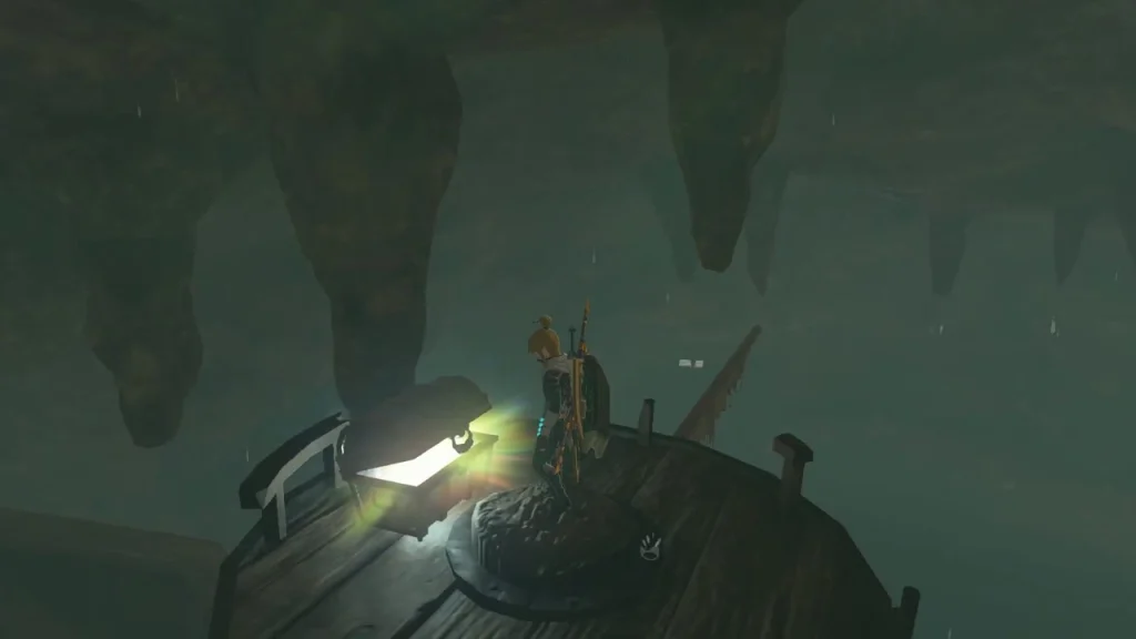 Glowing chest on the pirate ship deck beneath dripping stalactites