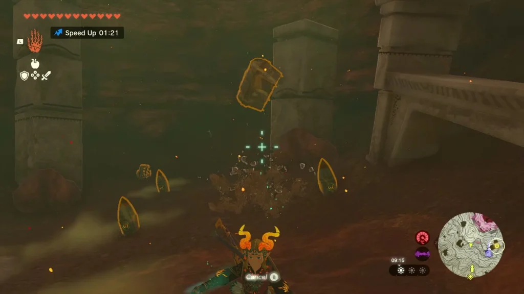 Rock rubble being smashed apart with a hammer in a dark passage