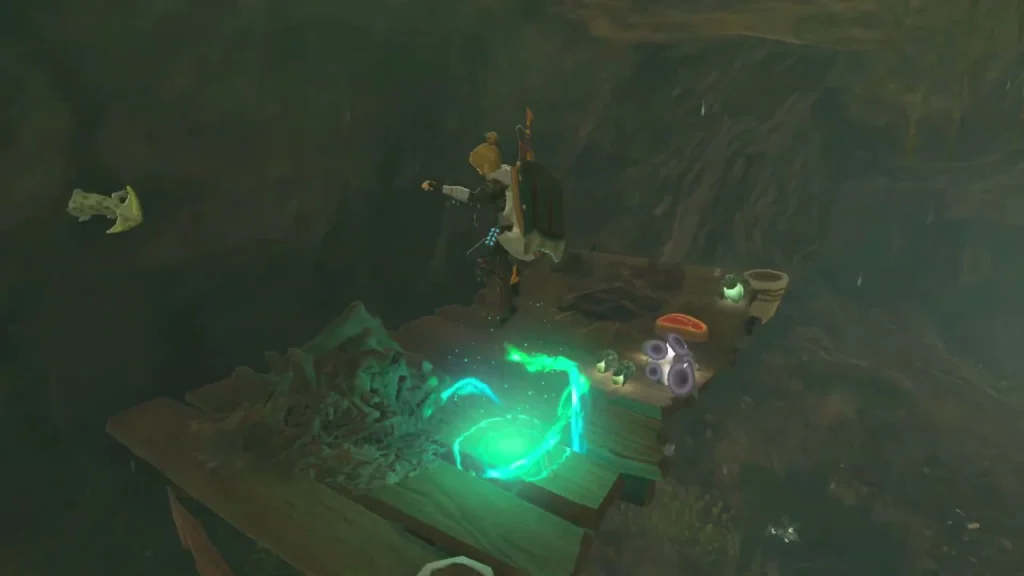 Wooden Horriblin camp platform with cooking pot and loot in the dark cavern Wooden Horriblin camp platform with cooking pot and loot in the dark cavern