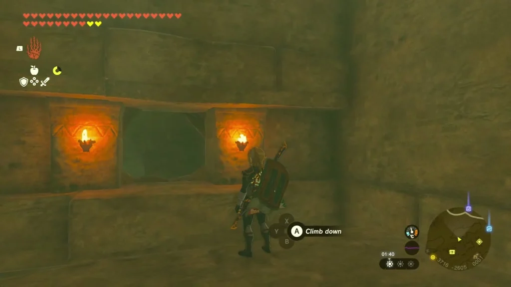 Climbable stone wall flanked by two burning torches
