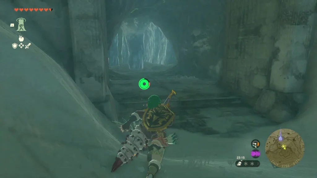 Stone archway at the cave entrance with ice behind it