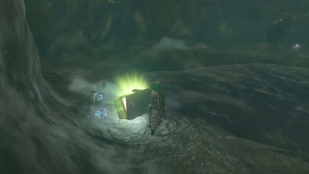 Glowing chest on a rocky ledge in the cave
