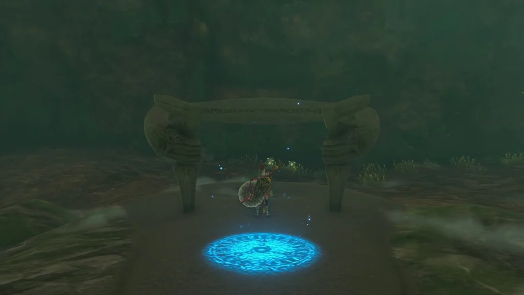 Shrine entrance gate and glowing blue pad at the end of the cavern Shrine entrance gate and glowing blue pad at the end of the cavern