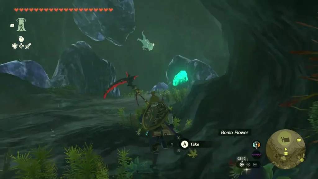 Dark inner cave with bomb flower and glowing ore on the wall Dark inner cave with bomb flower and glowing ore on the wall